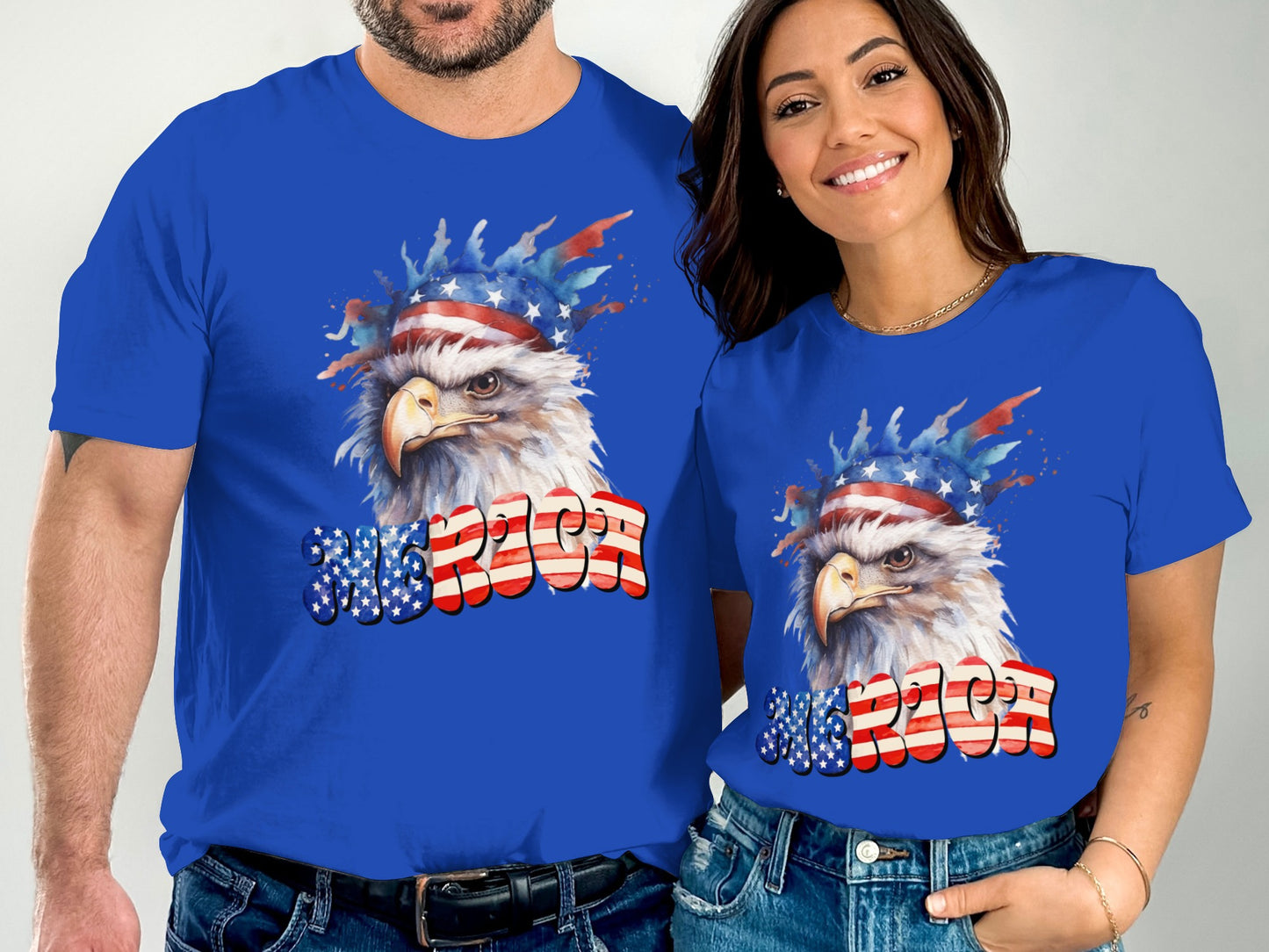 Two people wear blue t-shirts featuring an eagle with a patriotic headband and "USA" text.