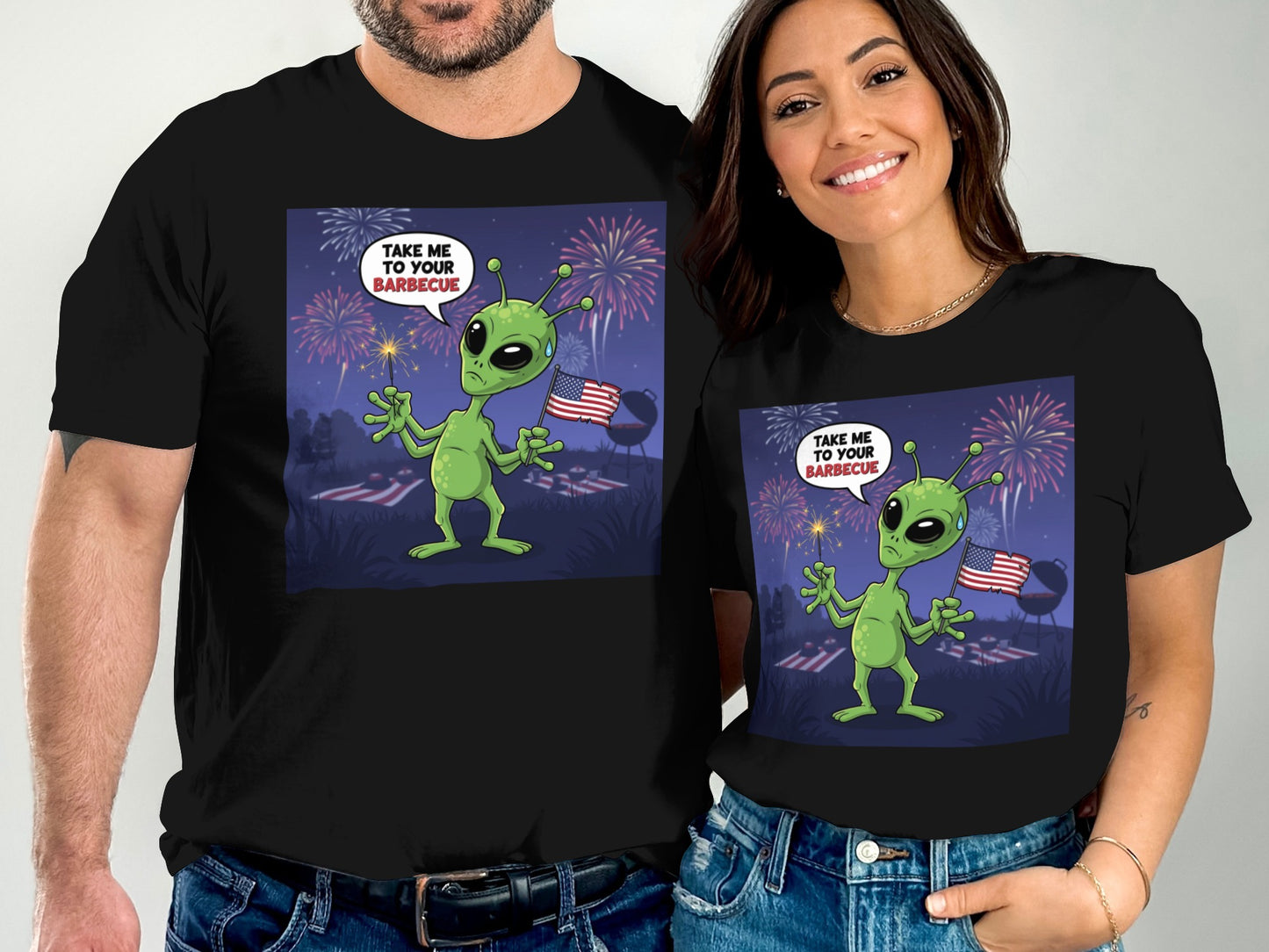 Alien wearing shirt that says "Take Me to Your Barbecue" with fireworks.