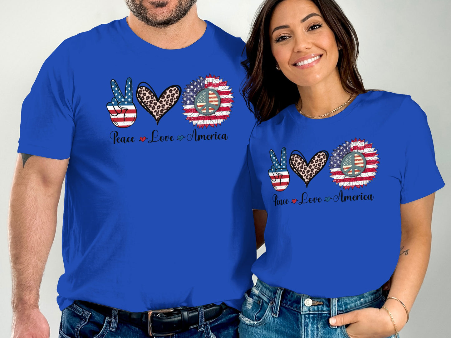 Couple wearing matching blue t-shirts with "Peace Love America" and patriotic designs.