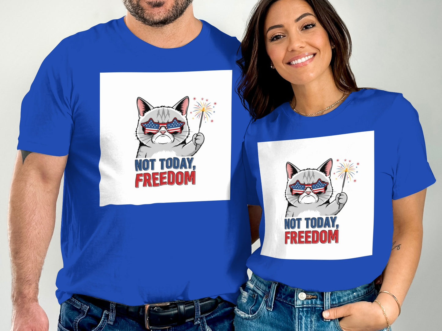 Couple in blue t-shirts with patriotic cat graphic, "NOT TODAY, FREEDOM".