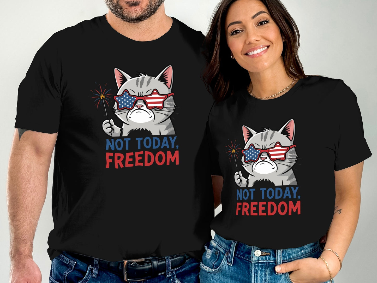 Couple in matching black t-shirts with patriotic cat graphic, "Not Today, Freedom".