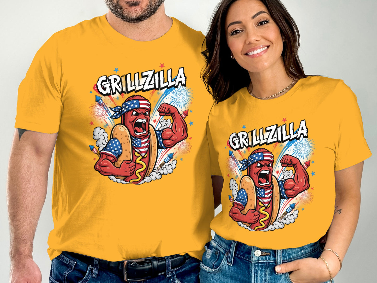 Man and woman in yellow t-shirts with "Grillzilla" hot dog graphic.
