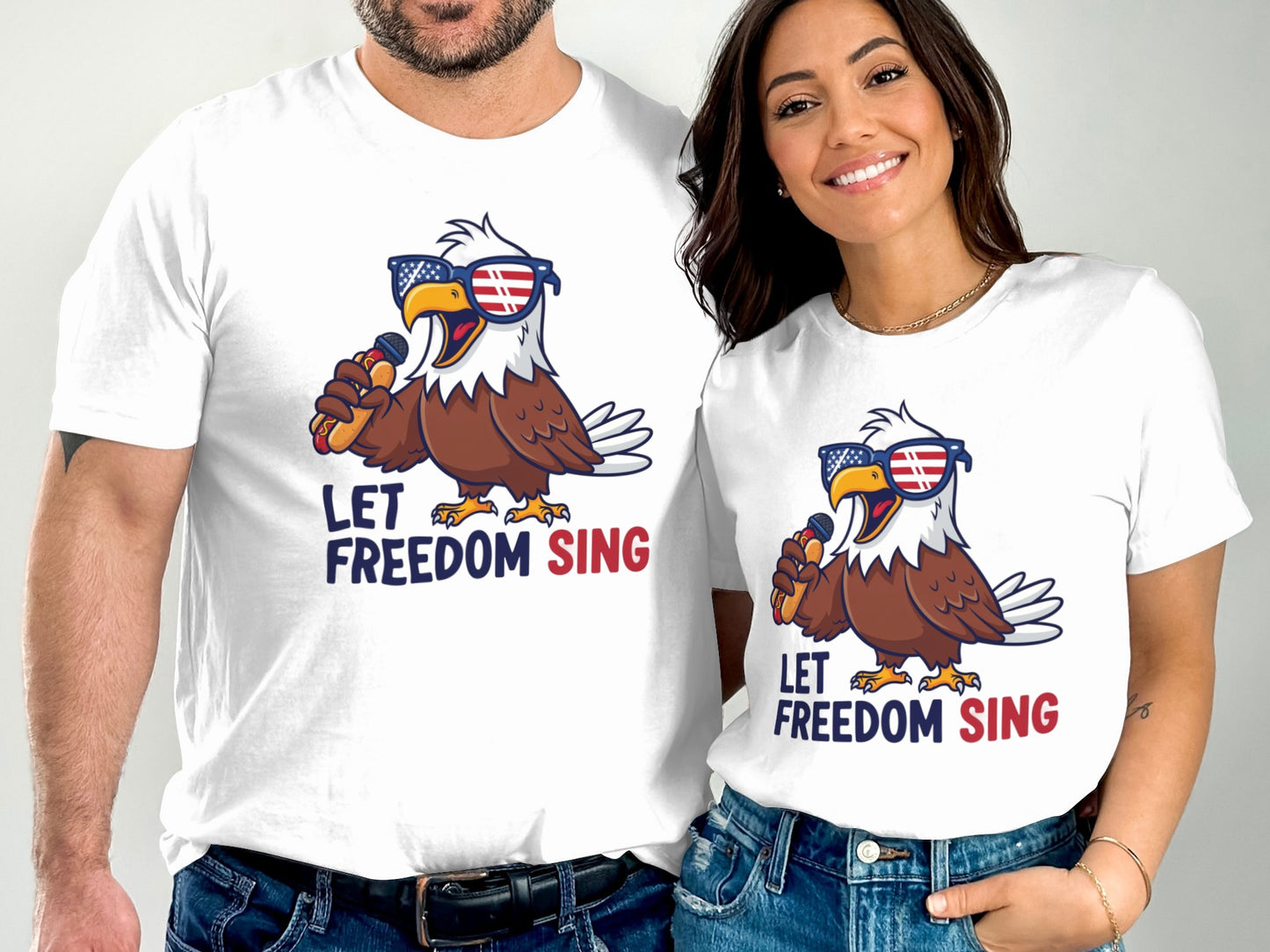 Two people wear white t-shirts with an eagle graphic and "LET FREEDOM SING".