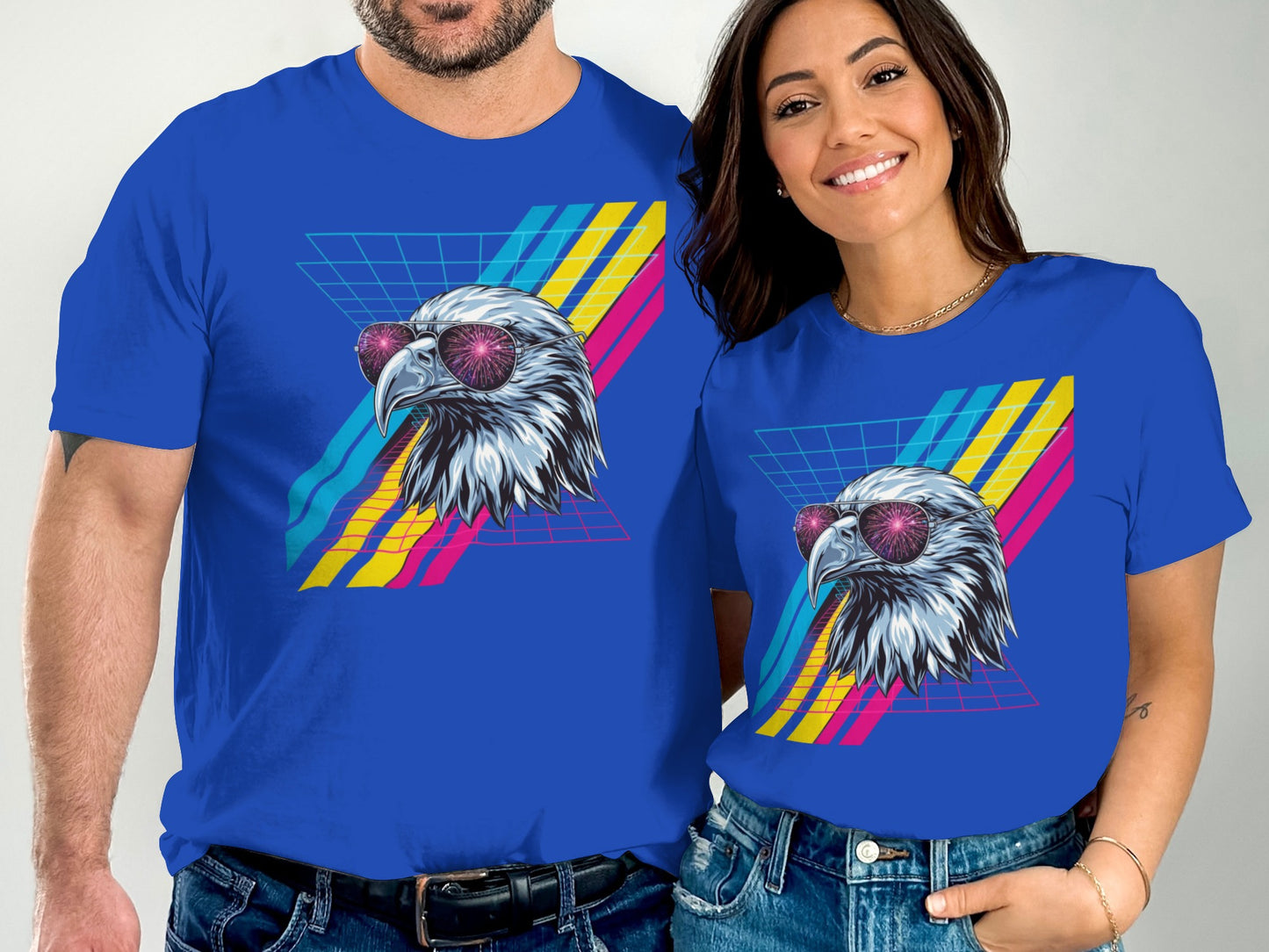 Couple wearing blue t-shirts with retro eagle graphic.