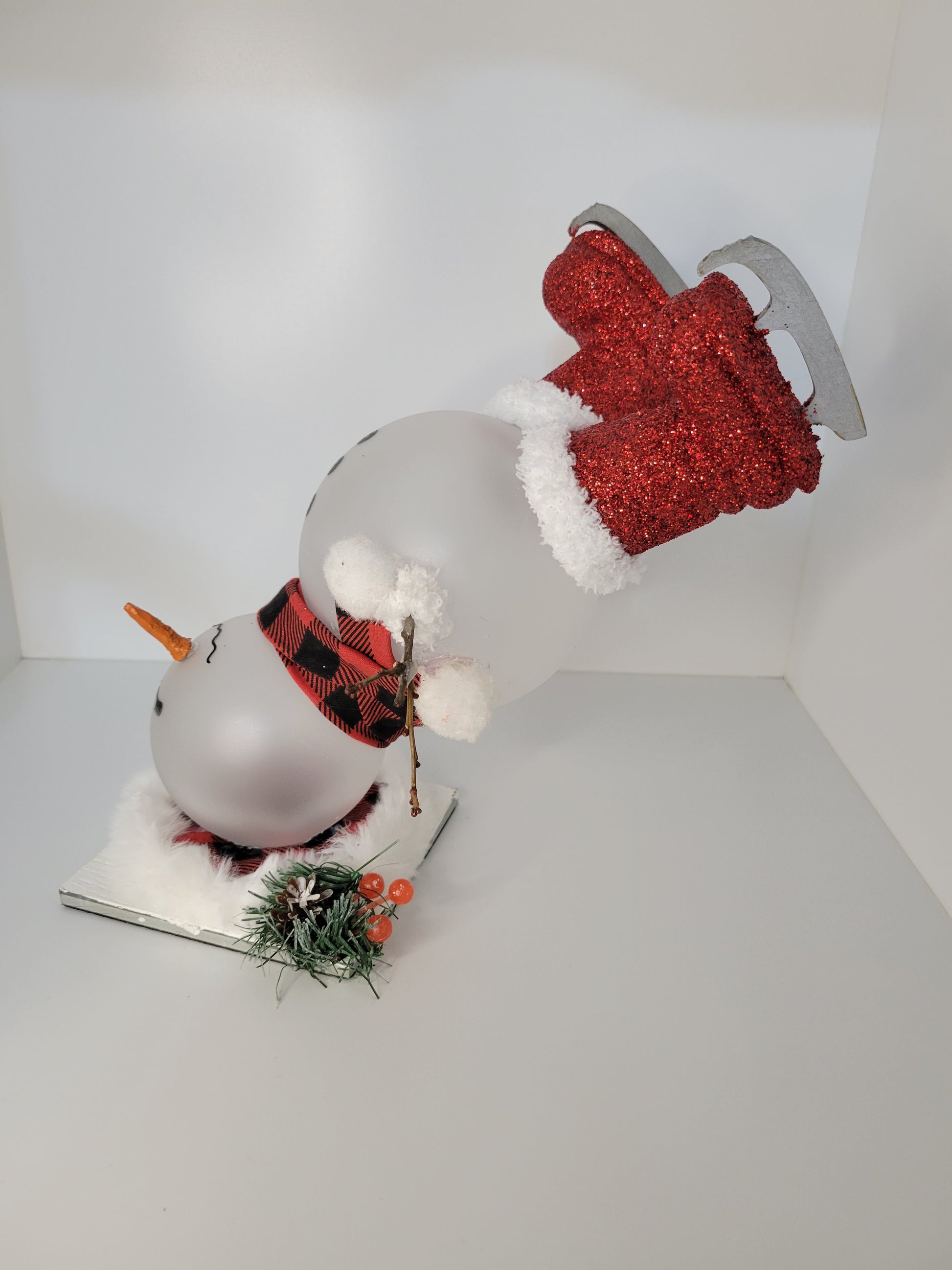 Adorable Snowman Figure with Festive Red Ice Skates