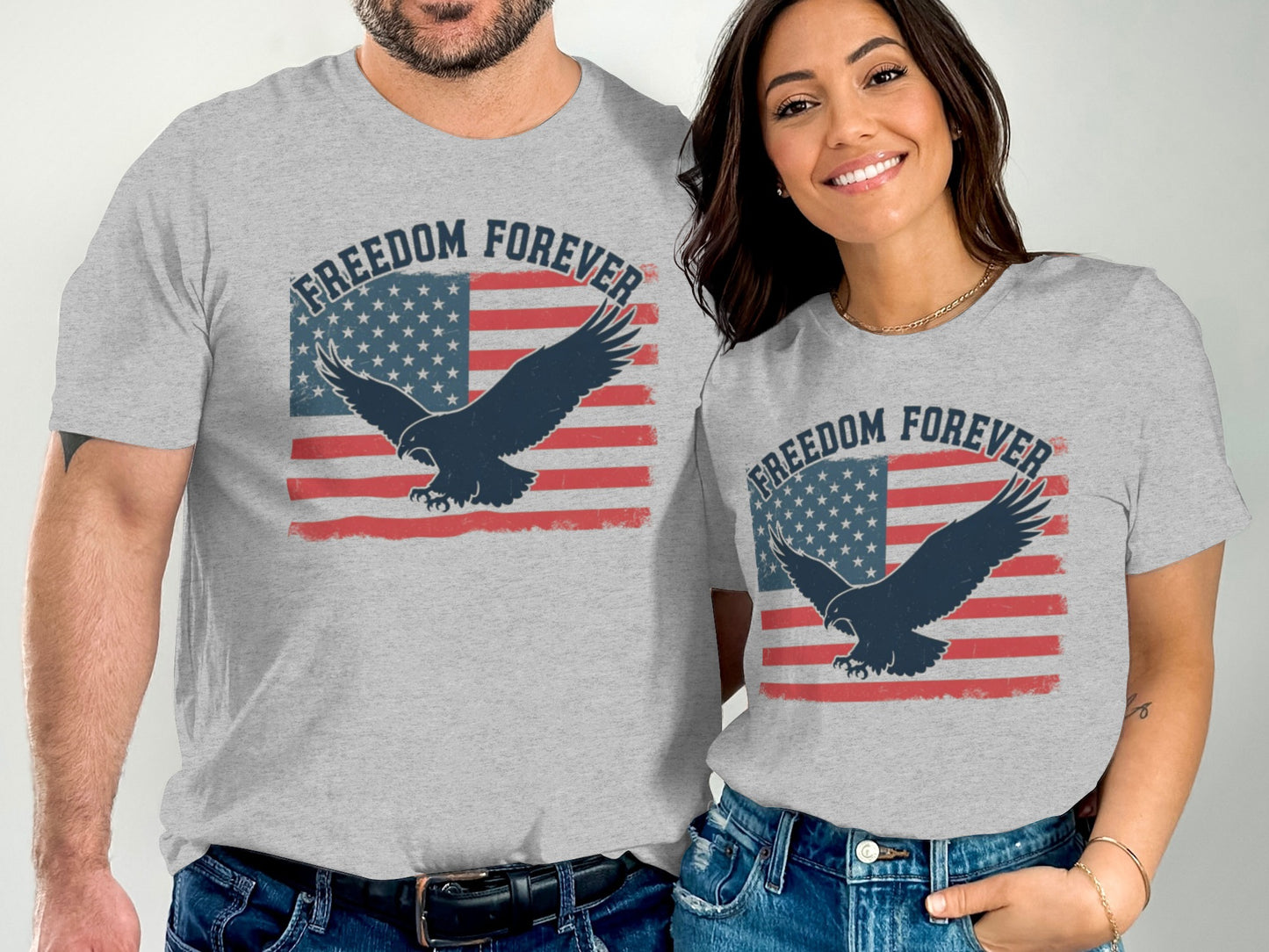 Two people wearing grey t-shirts with "Freedom Forever" and an eagle over a US flag.