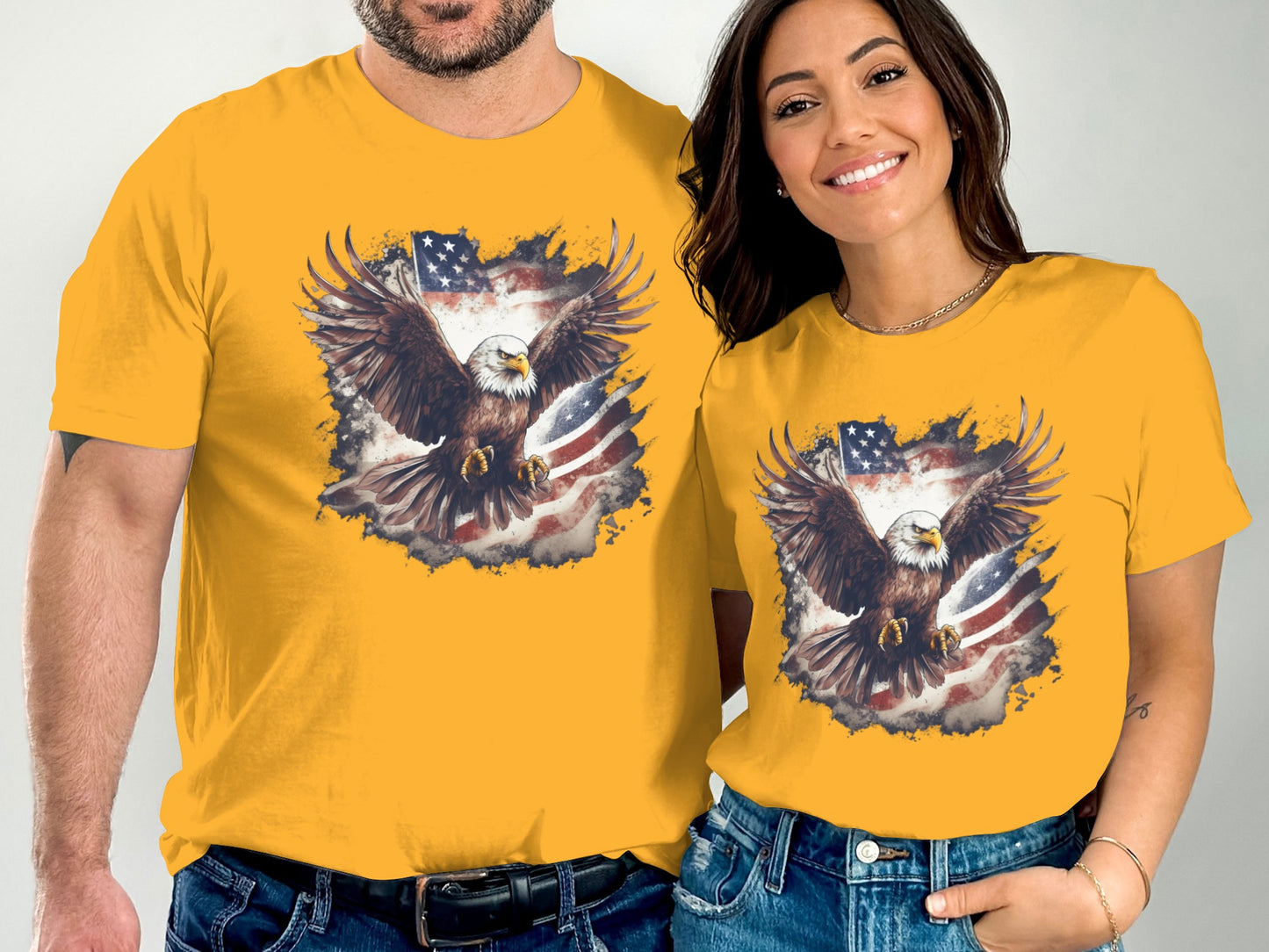 Two people wear yellow t-shirts with a patriotic eagle and American flag design.