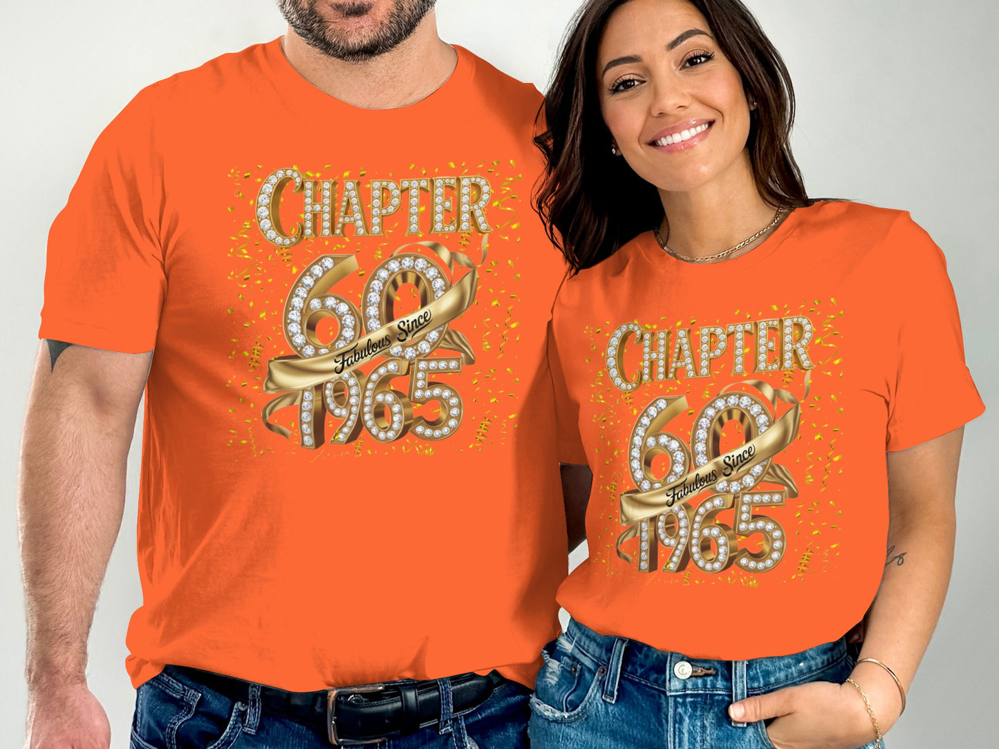 Two people wearing orange t-shirts with Chapter 60 Fabulous Since 1965 design and gold confetti accents