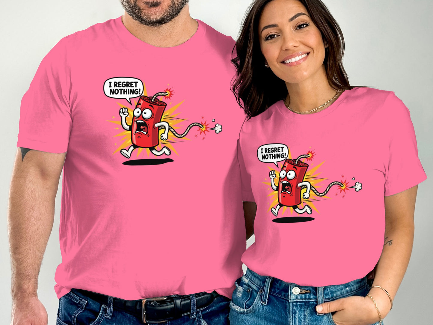 Two people wear pink t-shirts with a cartoon firecracker exclaiming "I regret nothing!".
