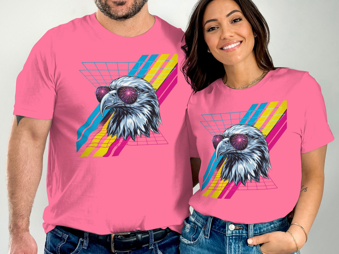 Pink t-shirts with retro eagle design and grid pattern.