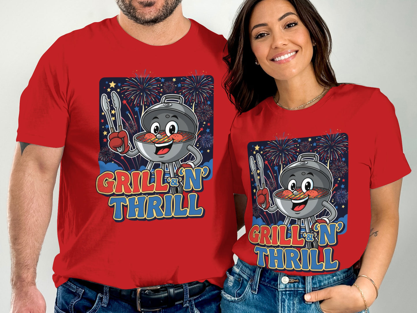 Couple wearing matching red t-shirts with grill and fireworks graphic.