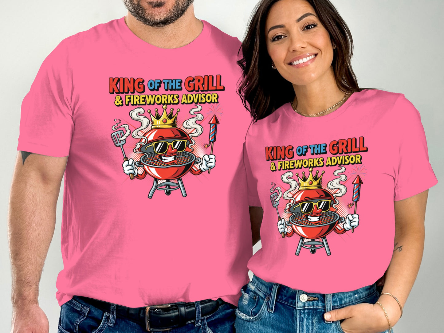 Pink t-shirts with cartoon grill and text "King of the Grill & Fireworks Advisor."