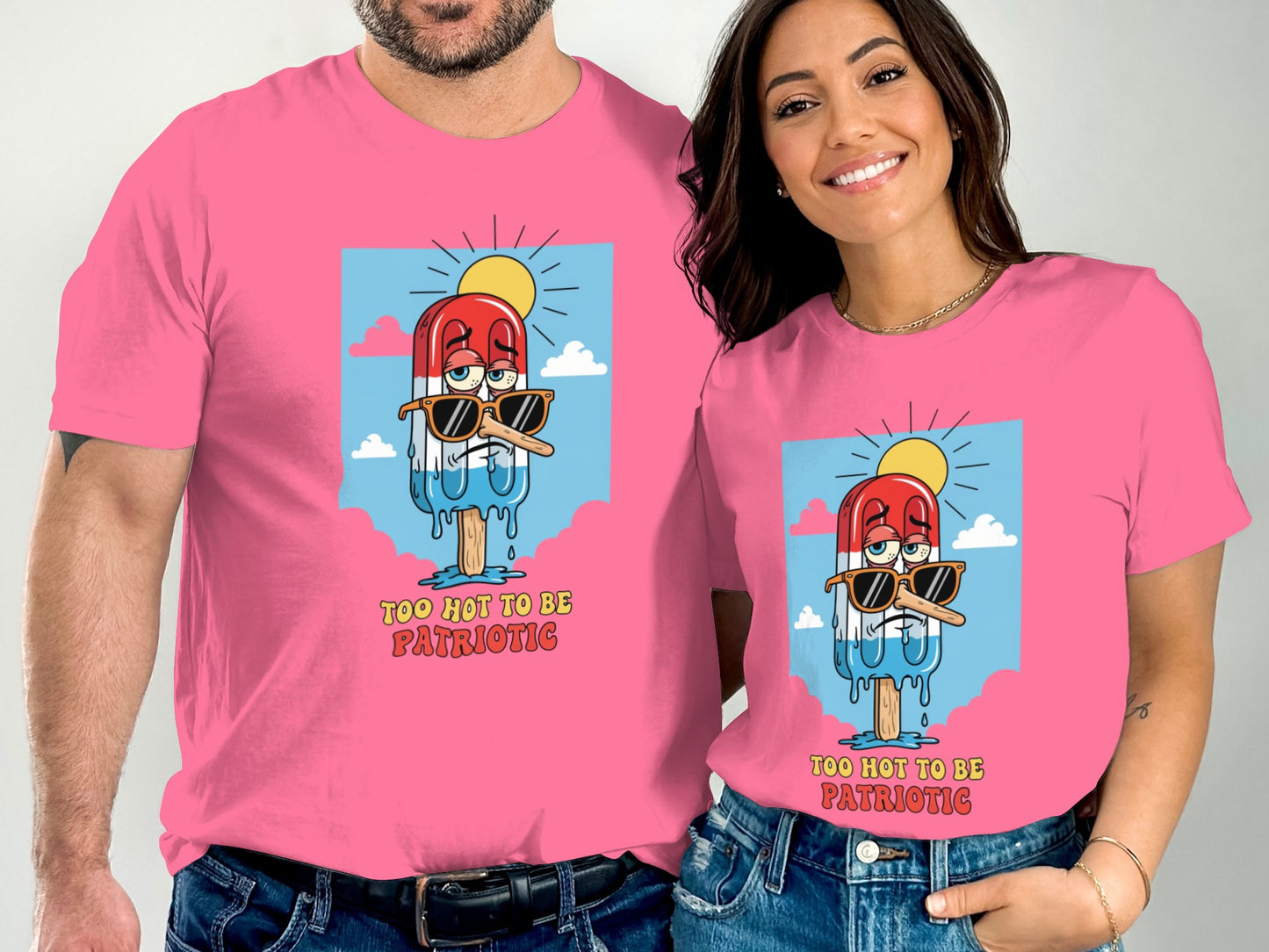 Two people wear pink t-shirts with a popsicle graphic and text.