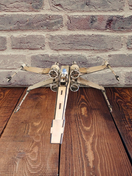 Intricate Wooden Model of Famous Starfighter Toy