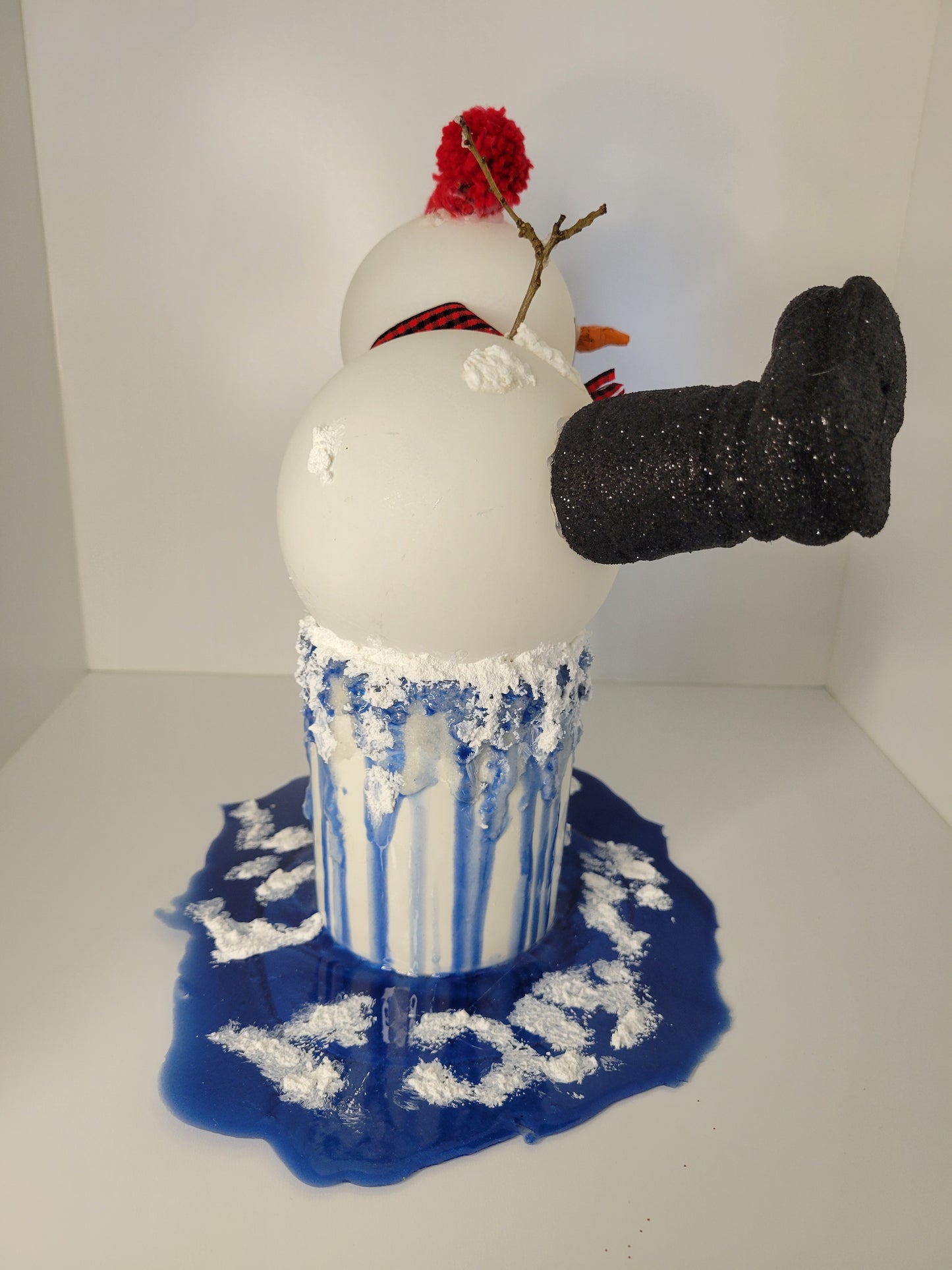 Melting Snowman Candle with Blue Drips and Snowflakes