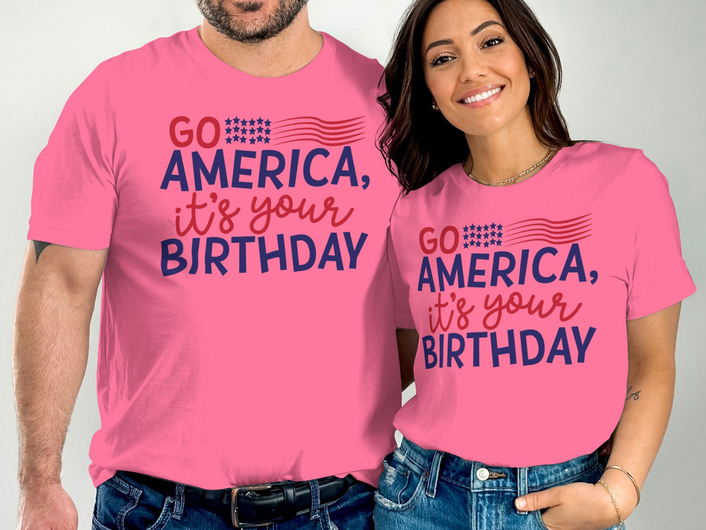 Two people wearing matching pink t-shirts with "GO AMERICA, IT'S YOUR BIRTHDAY" text.