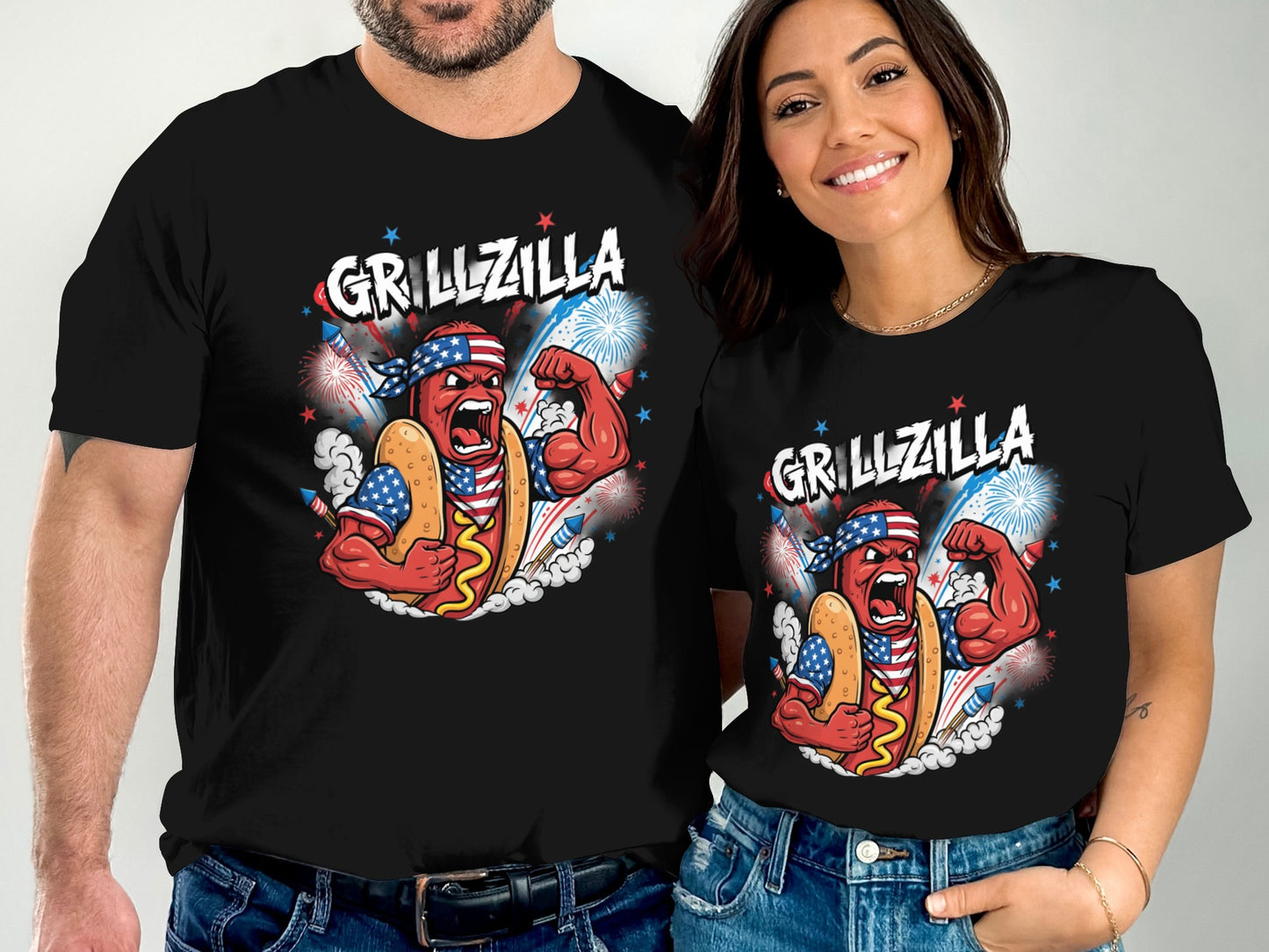 Man and woman in black t-shirts with "Grillzilla" hot dog graphic.