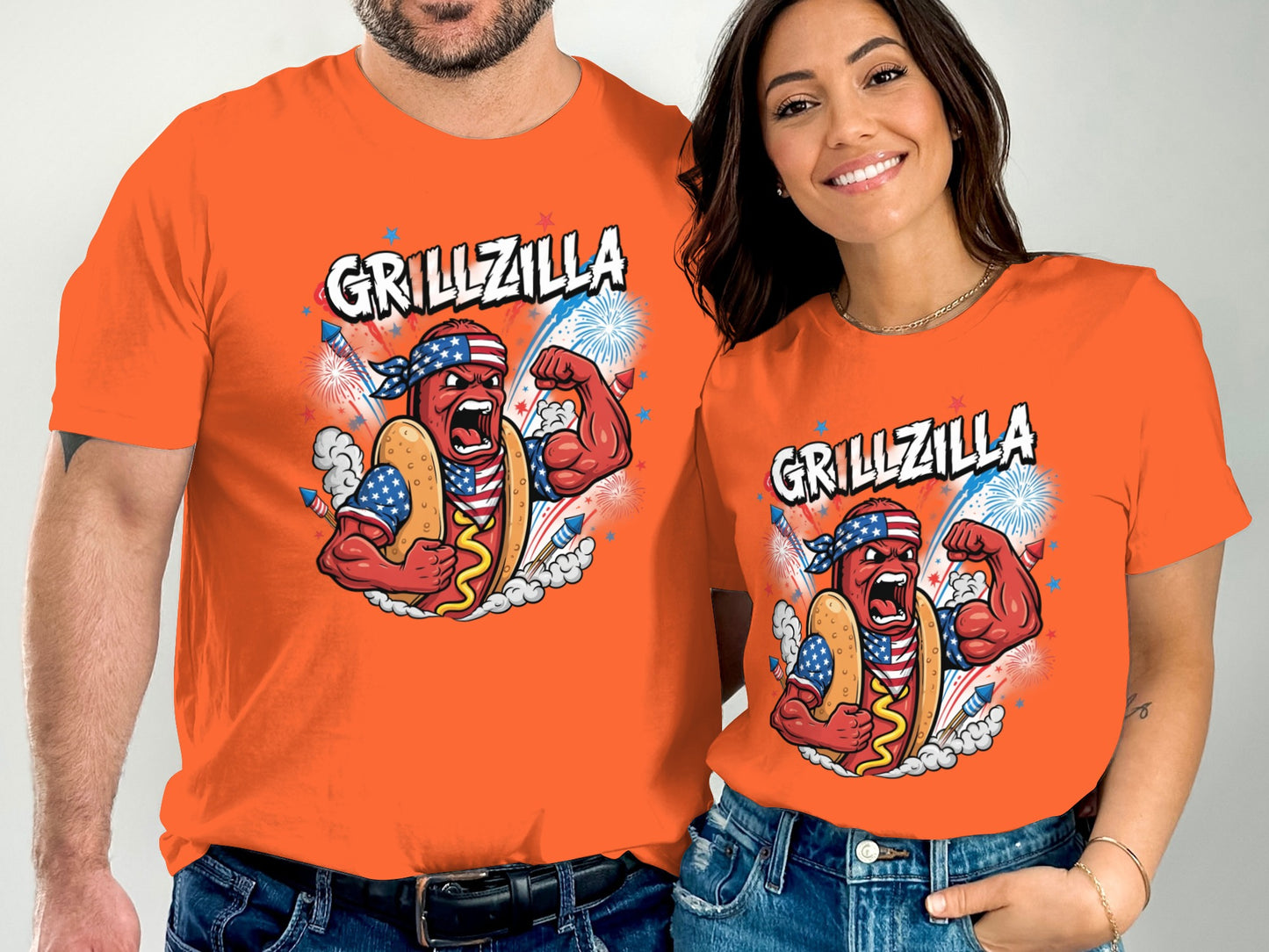 Men's and women's orange t-shirts with "Grillzilla" hot dog graphic.