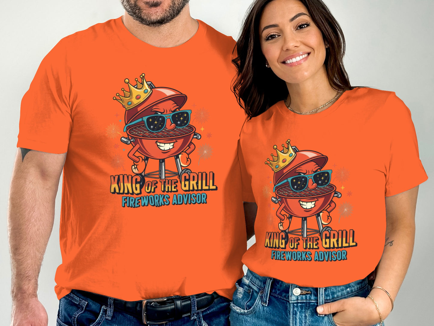 Couple wearing orange t-shirts with cartoon grill king text.