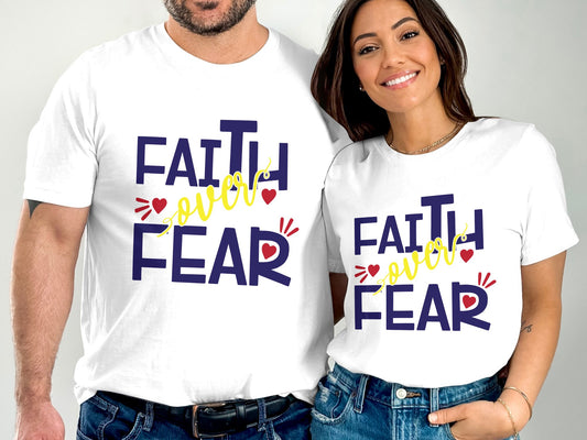 Couple wearing matching white Faith Over Fear t-shirts with bold navy and yellow text design