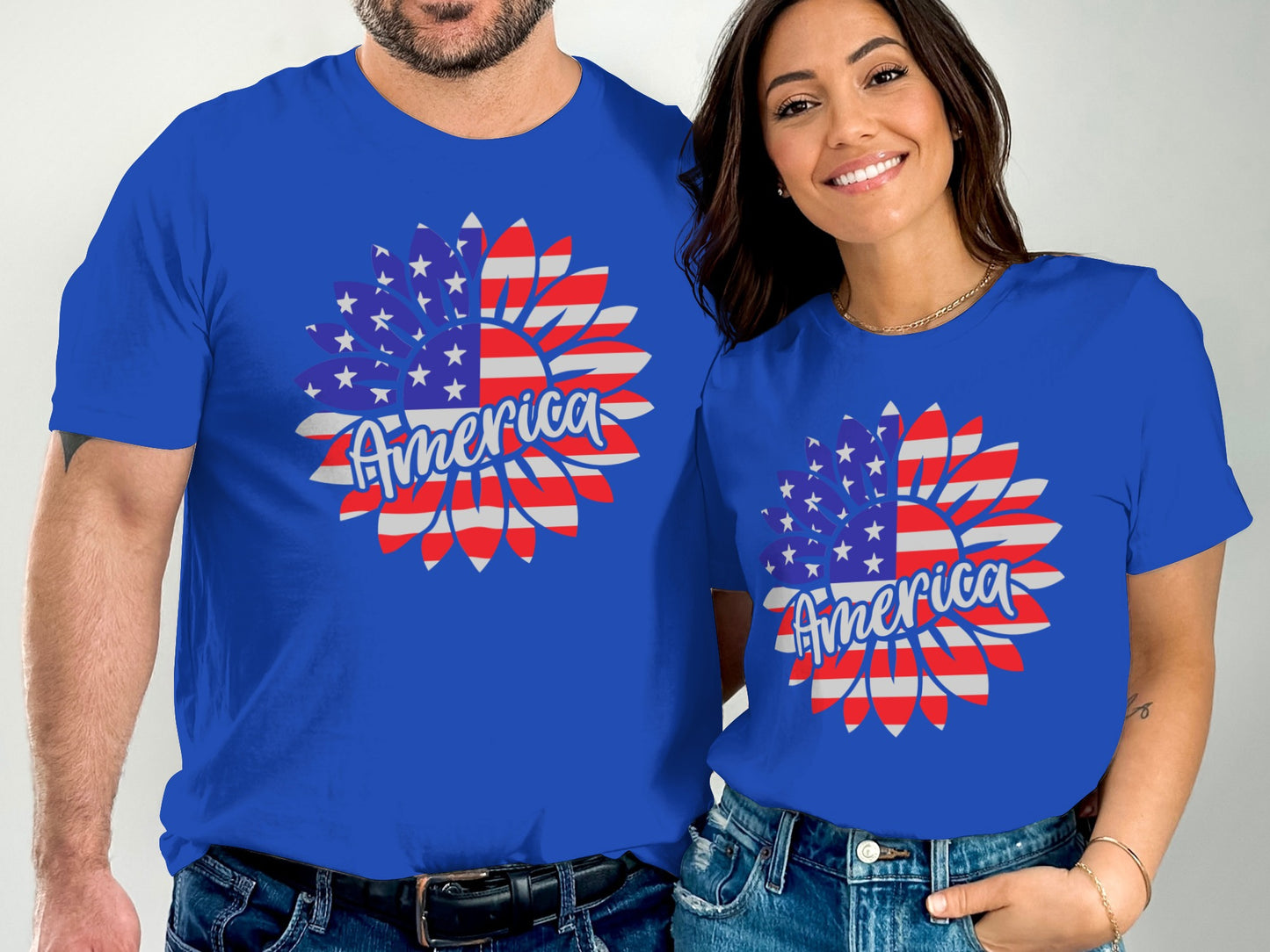 Couple wearing matching blue t-shirts with an American flag sunflower design.