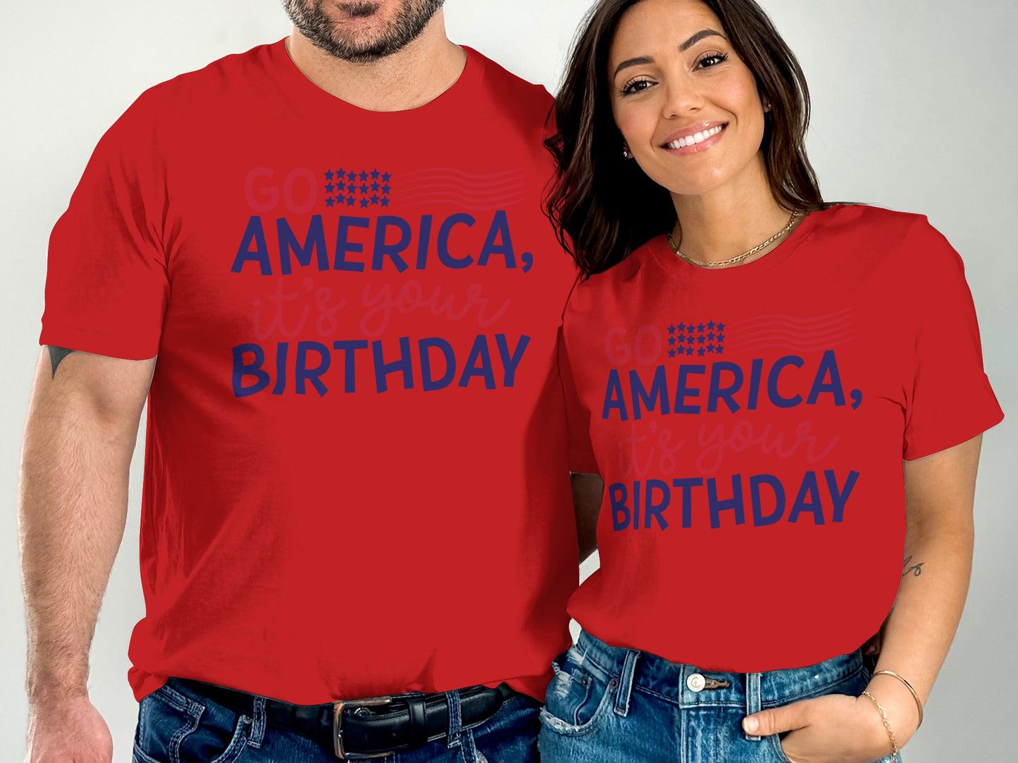 Couple wearing matching red "GO AMERICA, IT'S YOUR BIRTHDAY" t-shirts.