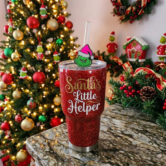 Grinch straw topper on a green glitter tumbler